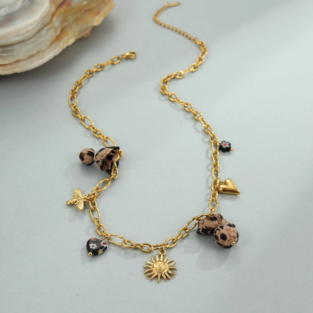 Leopard pendant with heart and flower elements on stainless steel necklace, electroplated 18K finish
