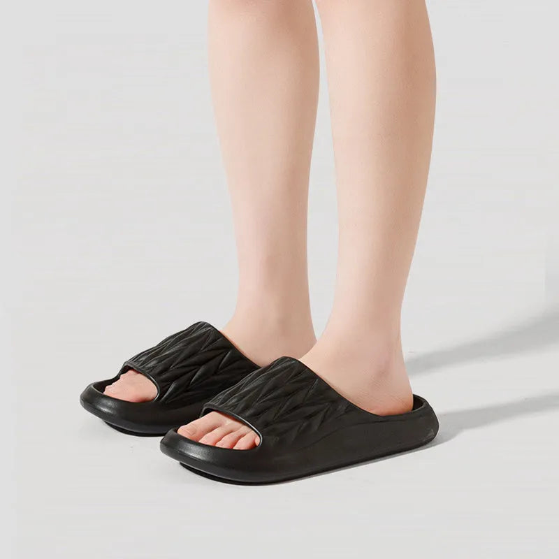 Leaf texture patterned EVA foam slippers for indoor household use, shown in multiple colours.