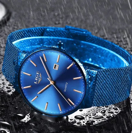 Men's stainless steel watch with 40mm dial on a wrist, showing slim profile.