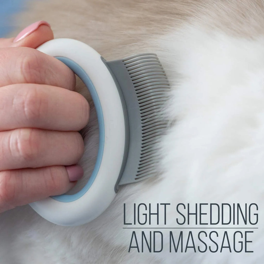 Blue pet grooming comb with soft teeth and ergonomic handle for deshedding cats and dogs.