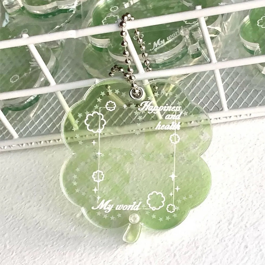Lucky four-leaf clover shaped acrylic pendant keychain in blue, green, or mint green colours.