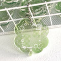 Lucky four-leaf clover shaped acrylic pendant keychain in blue, green, or mint green colours.
