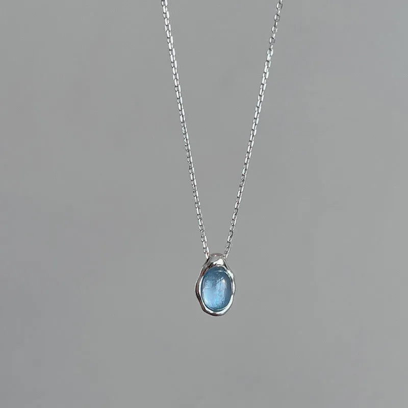 Women's navy blue water drop pendant necklace with geometric copper pendant and cross chain design