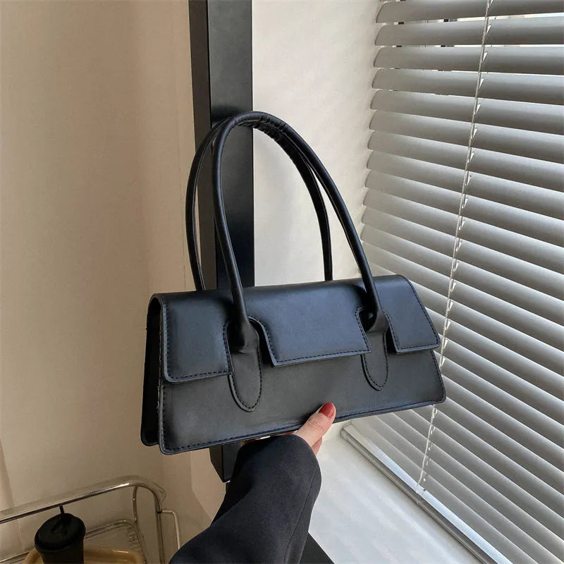 Women's black PU leather square handbag with single shoulder strap and stitching detail