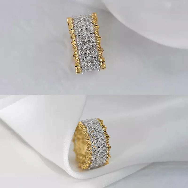 Geometric two-tone copper ring with a round zircon stone, shown on a finger.