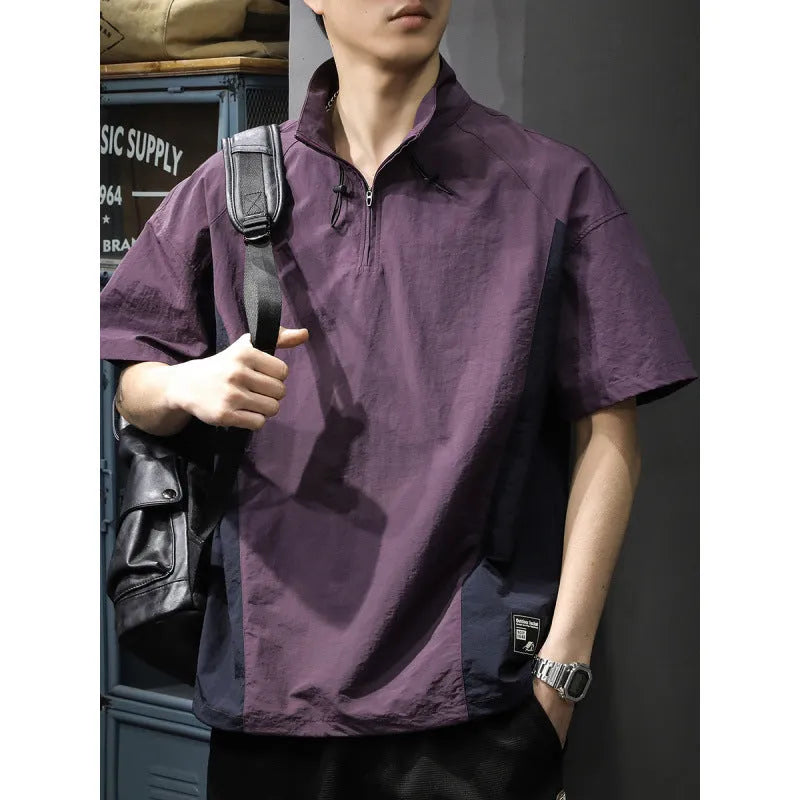 Brown men's loose-fit T-shirt with a half-zip stand collar and short sleeves.