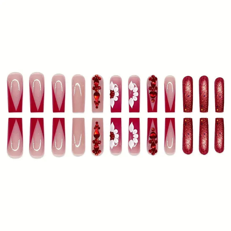 Sweet floral pattern fake nails with prismatic red diamond finish on long European square shape.