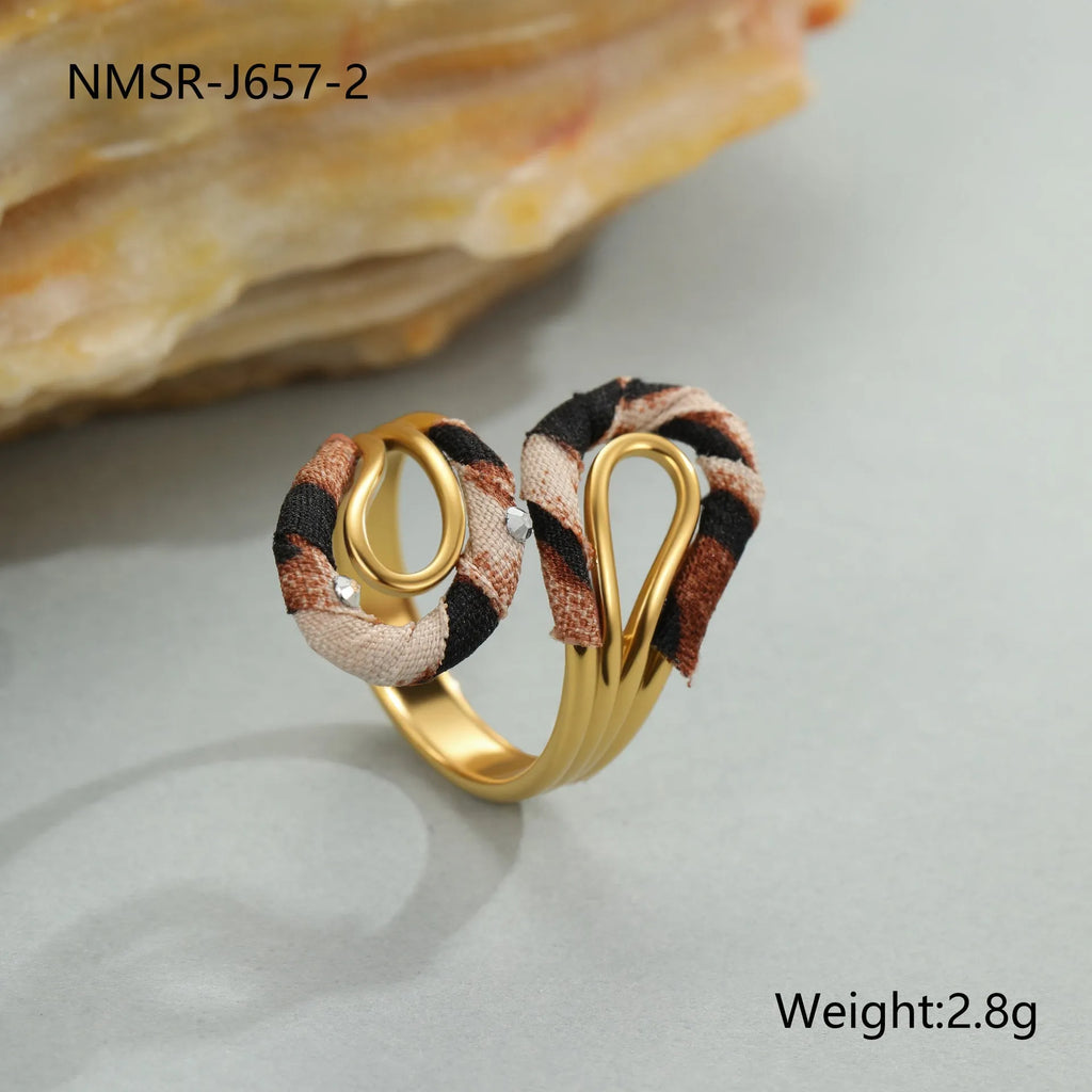 Geometric leopard print open mouth ring in stainless steel, shown in various colour options.