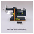 Alloy steel watch strap stripping machine tool for watch repair on a workbench.