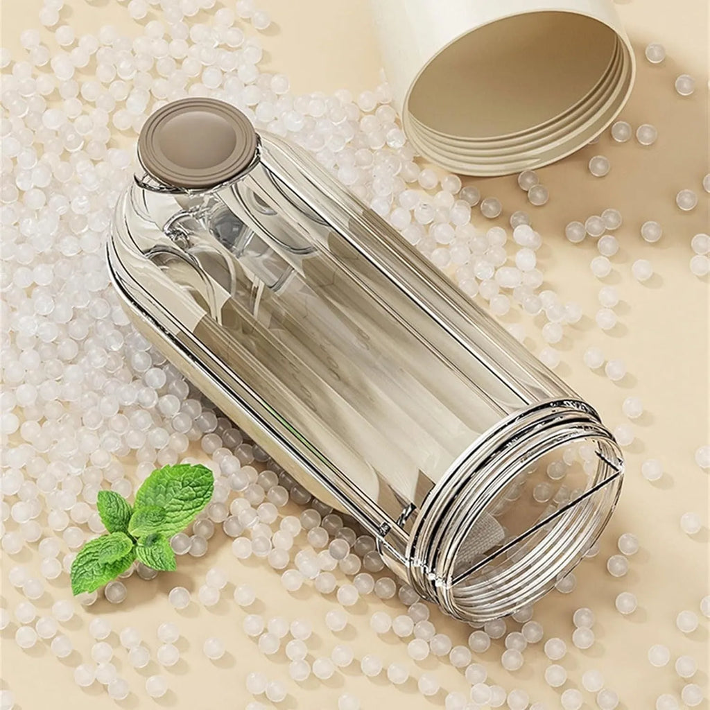 Beige and green foldable dog water bottle with food dispenser base for outdoor walking and travel.