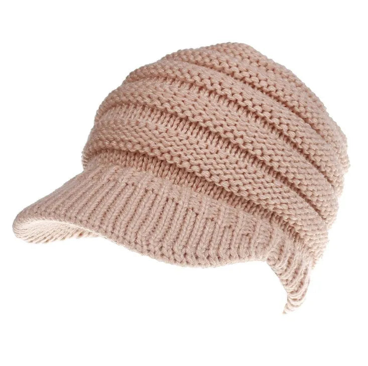 Women's acrylic ponytail beanie with back opening showing hairstyle accommodation