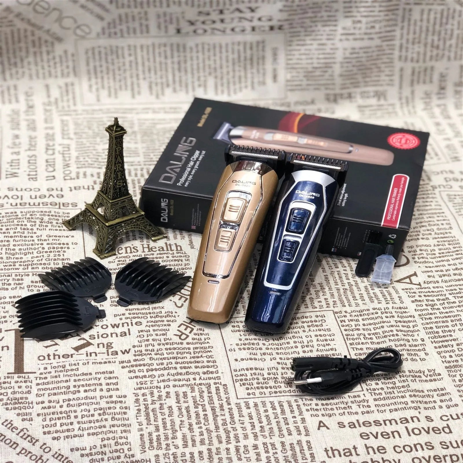 Dark blue rechargeable electric hair clipper with stainless steel blades on a white background.