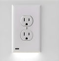 White socket induction LED night light plugged into a wall outlet.