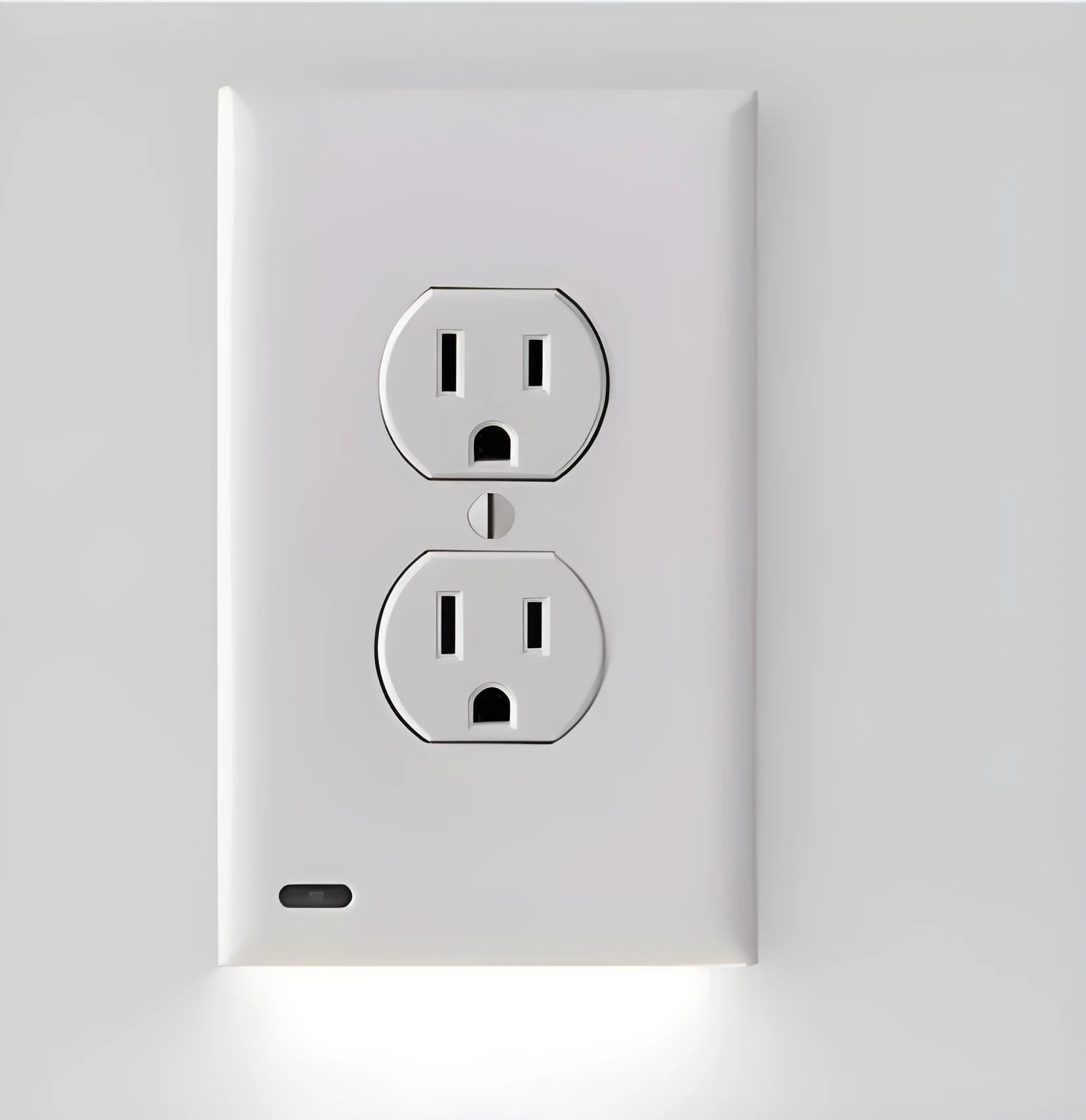 White socket induction LED night light plugged into a wall outlet.