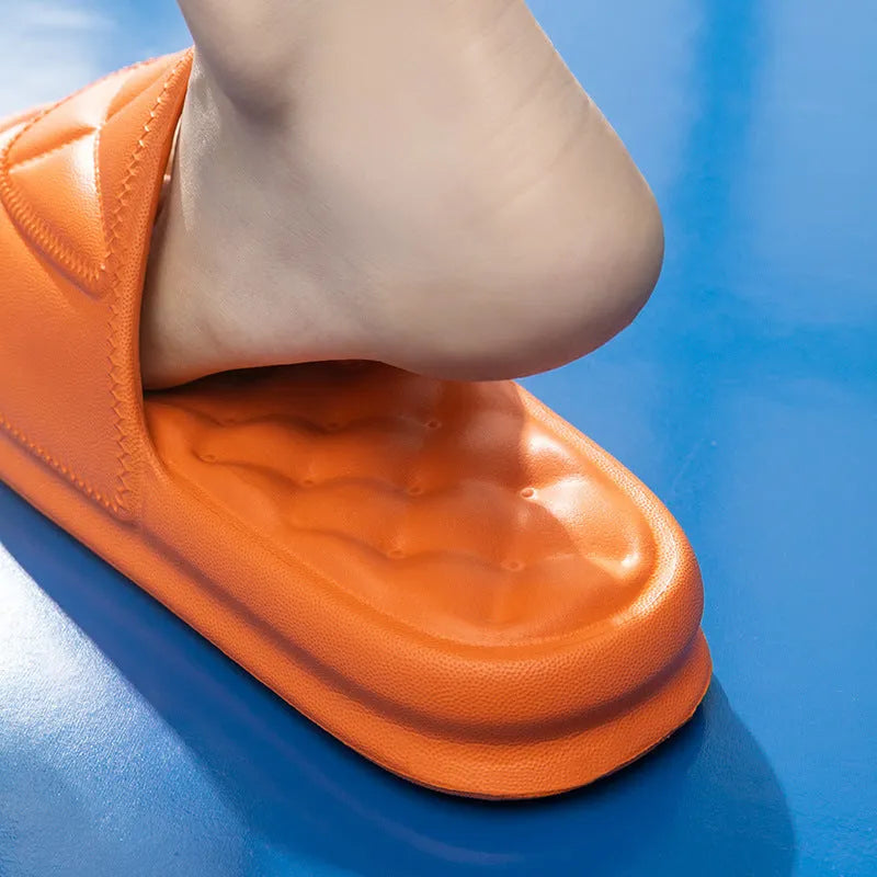 A pair of soft EVA bathroom slippers with a thick, textured non-slip sole in a choice of colours.