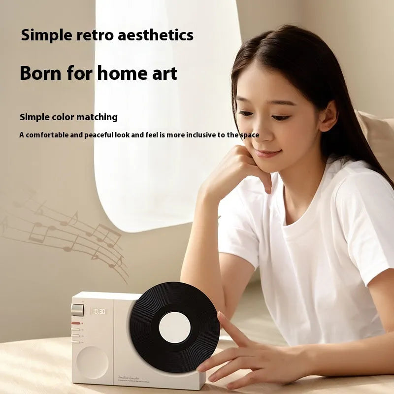 Mini Bluetooth portable speaker in coral pink colour showing USB charging port and card insertion slot