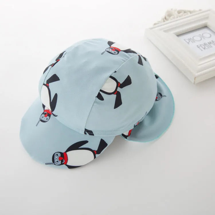 Boys penguin print long sleeve one-piece swimsuit with matching swim cap on size chart