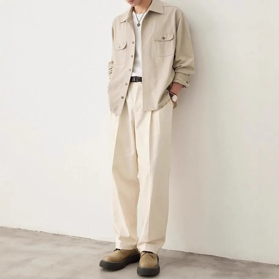 Men's simple profile cotton lapel shirt in light sand rice colour, showing long sleeves and collar detail.