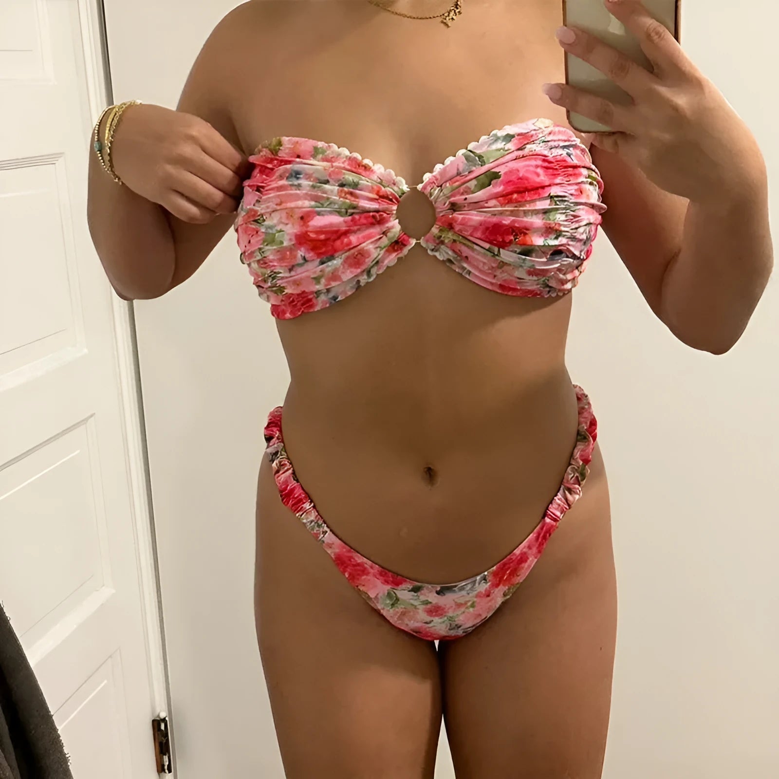 Women's floral print bikini set with lace trim on a tube top and briefs in blue.