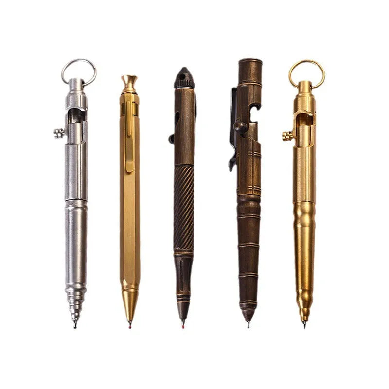 Retro brass tactical pen with a cylindrical barrel and bolt action mechanism on a dark background.