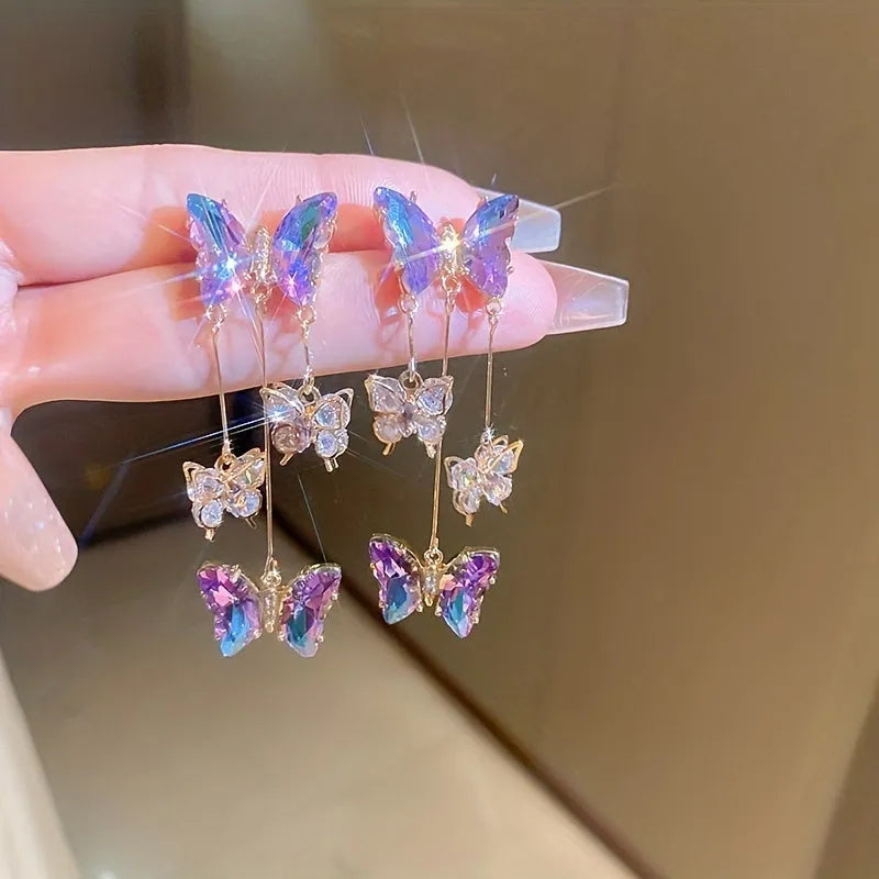 Silver needle crystal flowers butterfly tassel earrings in blue purple colour on alloy hooks