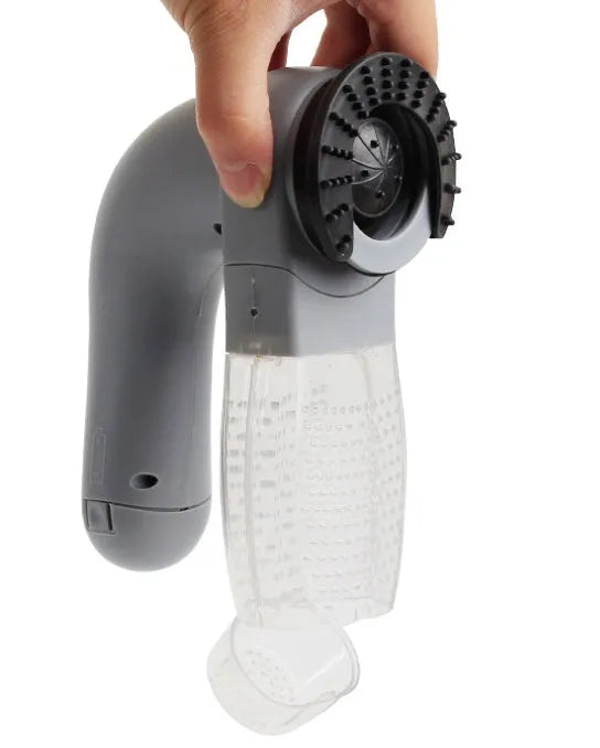 Grey handheld pet hair vacuum cleaner with soft rubber grooming head for dogs and cats