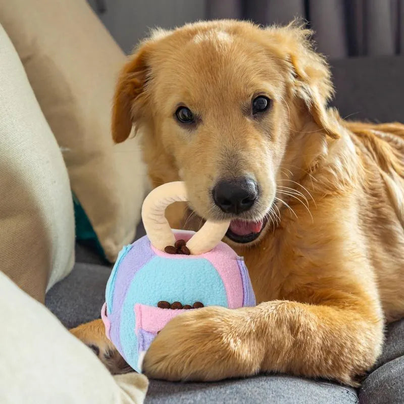 Pink or green plush squeaky ball dog toy with treat pockets measuring 12x12x18cm