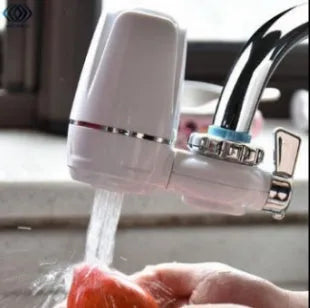 White plastic kitchen tap water filter with universal adapter and ceramic cartridge