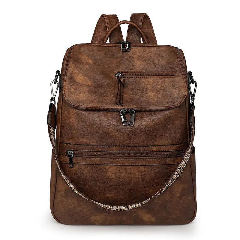 Retro college backpack with curved shoulder straps in six colour options including black, blue, and yellow apricot