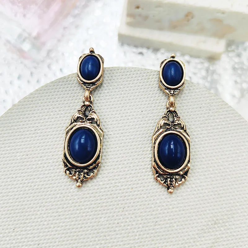 Retro Chinese style alloy earring pair with electroplated silver finish showing silver needle and triangle ear clip options