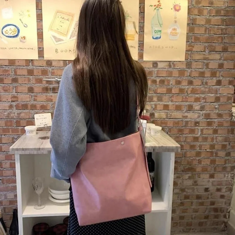 Corduroy one-shoulder commuter bag in pink or brown colour with 39cm length