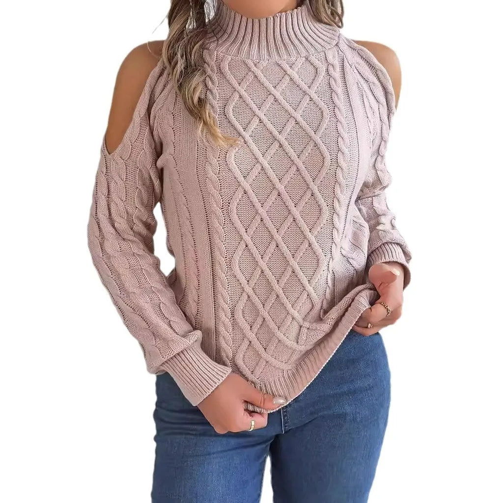 Woman wearing a grey twisted strapless sweater with half-high collar and lantern sleeves.