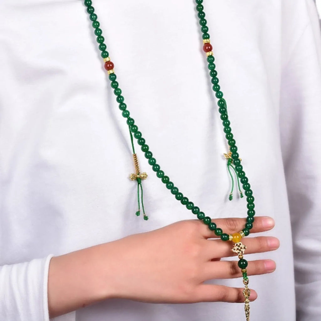 Brazilian green agate multi-strand bracelet showing different bead sizes on a wrist.