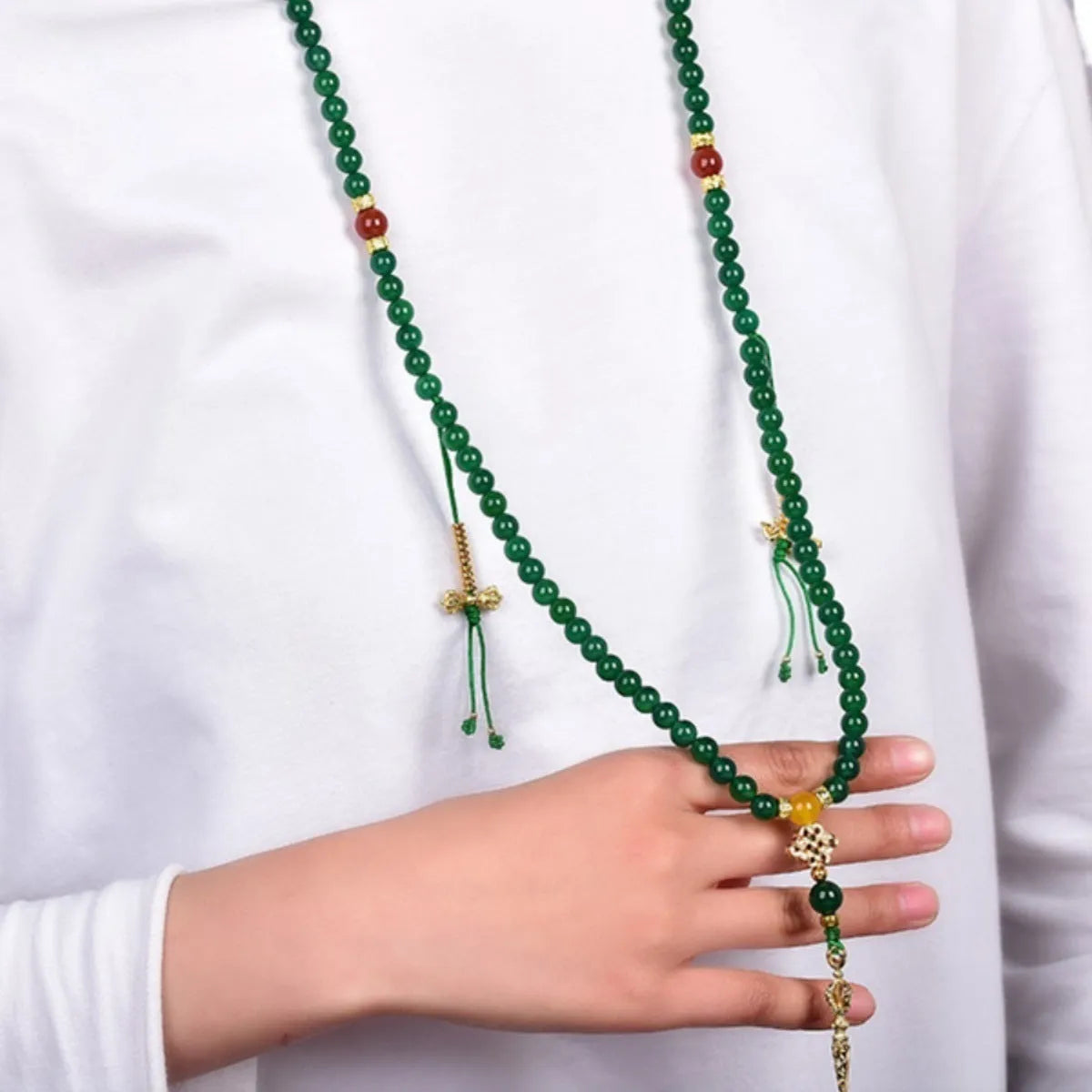 Brazilian green agate multi-strand bracelet showing different bead sizes on a wrist.
