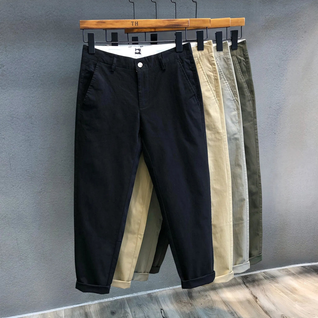 Men's cropped pure cotton casual pants in green, with mid waist and zipper fly.