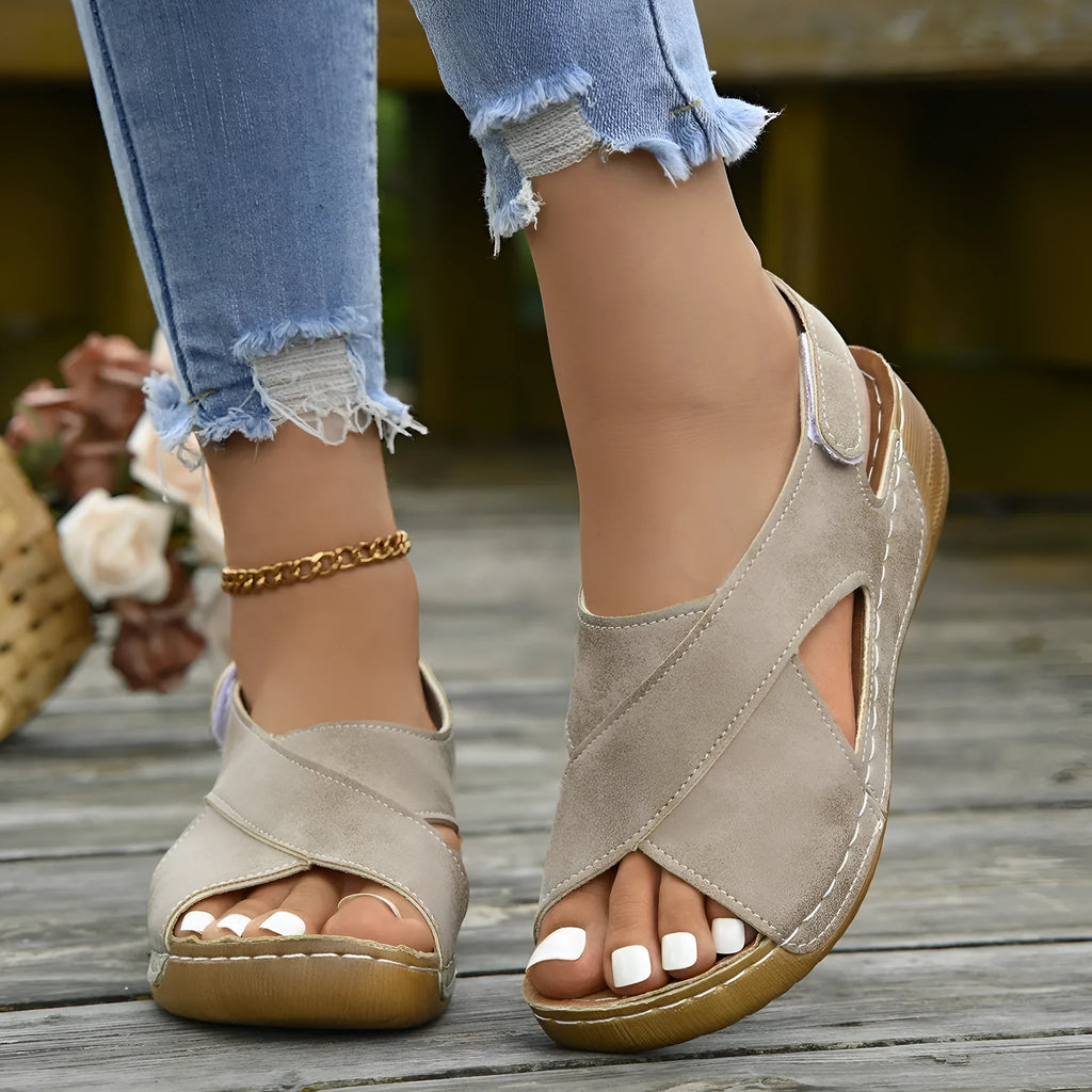 Women's brown platform sandals with a decorative skirt and Velcro strap fastening.