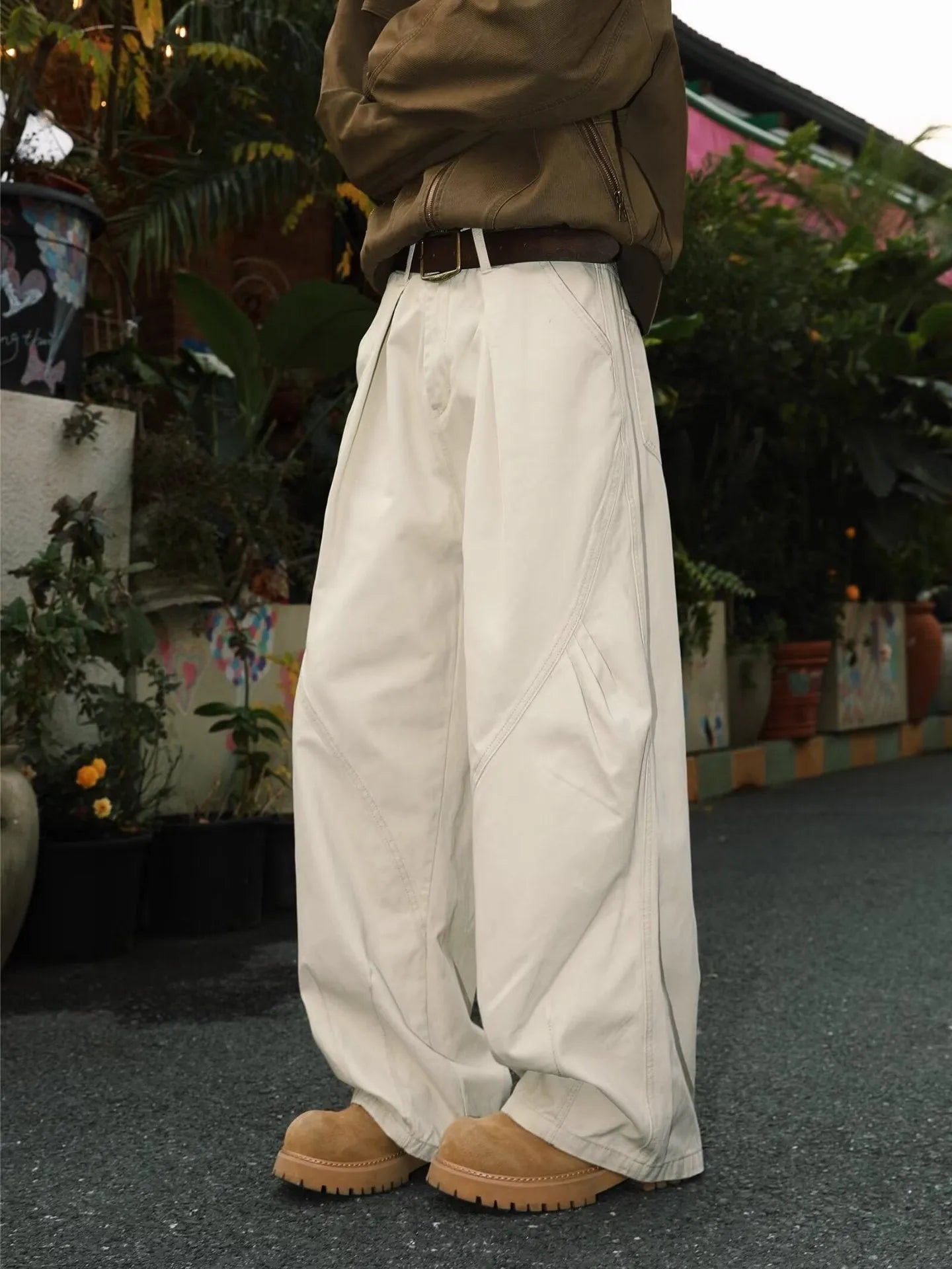 Men's pleated straight leg trousers in stripe patterns showing loose fit and micro elastic fabric