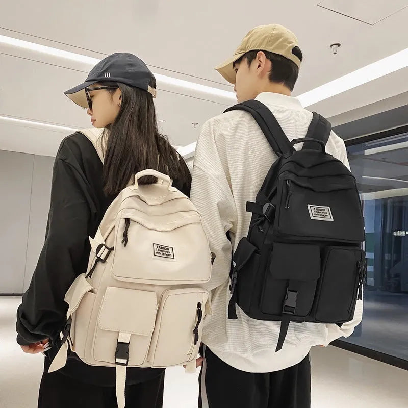 Black student backpack with three-dimensional pockets showing computer compartment