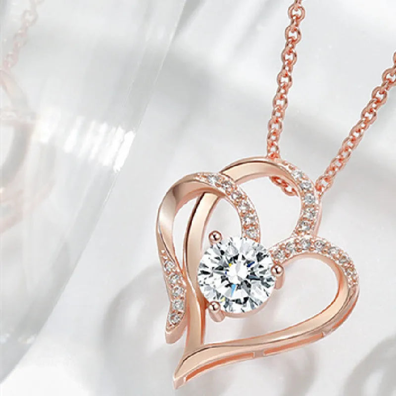 Close-up of a 925 silver heart-shaped pendant necklace on a chain.