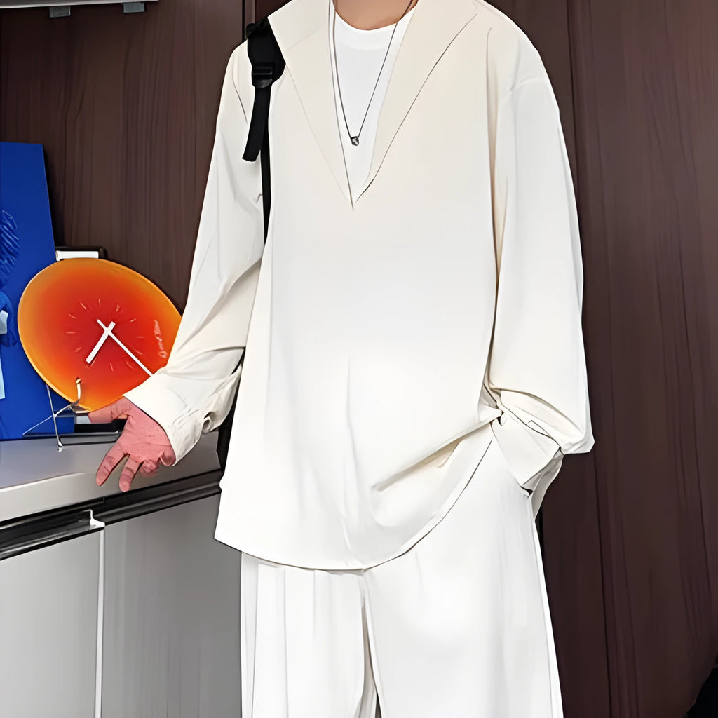 Man wearing a slim fit apricot coloured long sleeve polo shirt and matching trousers, a casual two-piece hemp suit set.