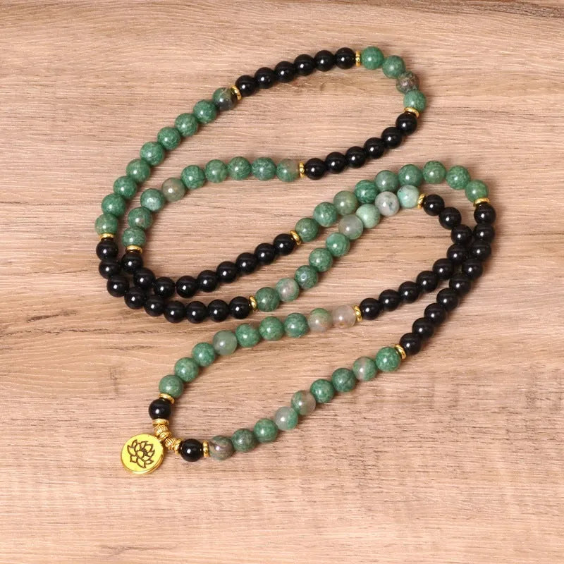 Green and black elastic beaded bracelet made from alloy material with natural styling
