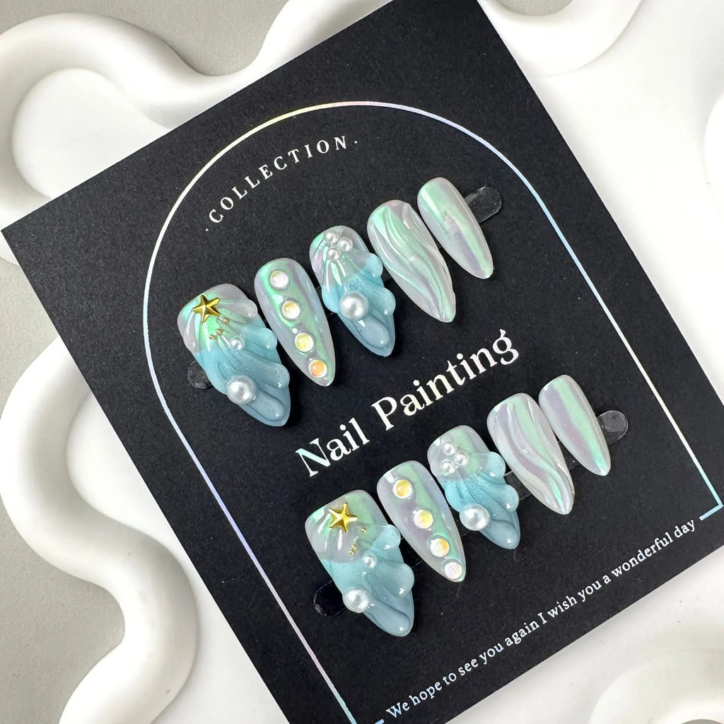 Blue summer design plastic false nail stickers in XS, S, M, L sizes.