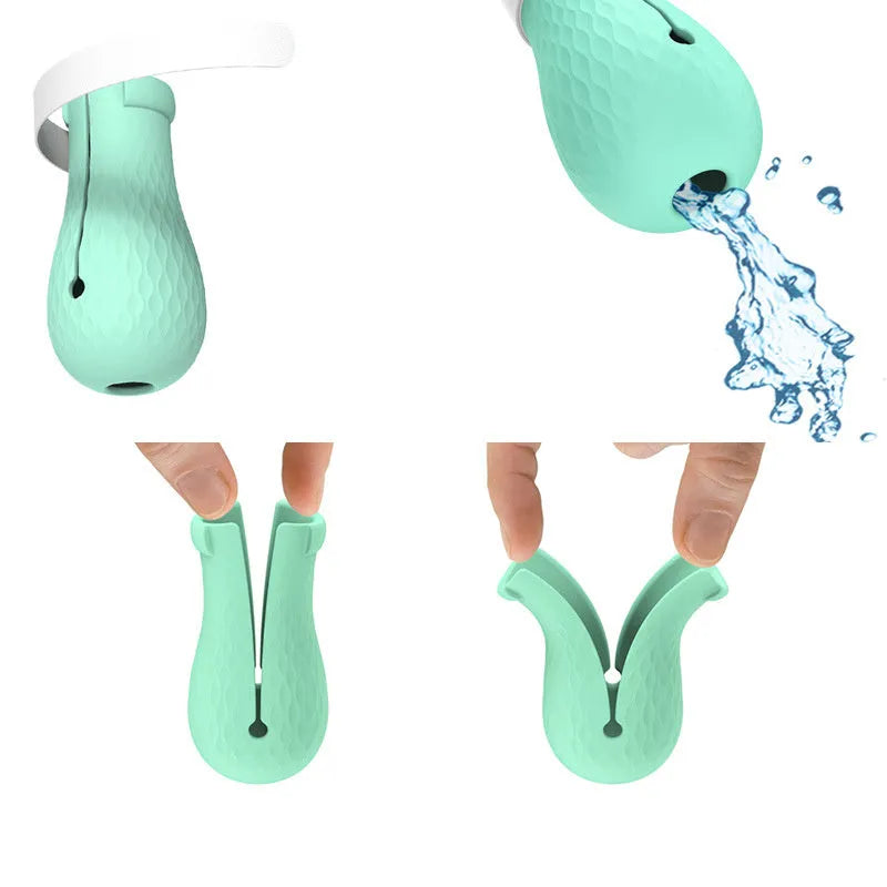 Four green silicone cat scratch prevention foot covers with an adjustable strap laid flat