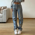Washed blue high-waist straight-leg jeans with contrast colour detailing on a denim background.
