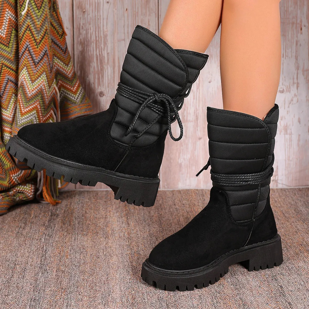 Women's black chunky heel snow boots with suede upper and lace-up design