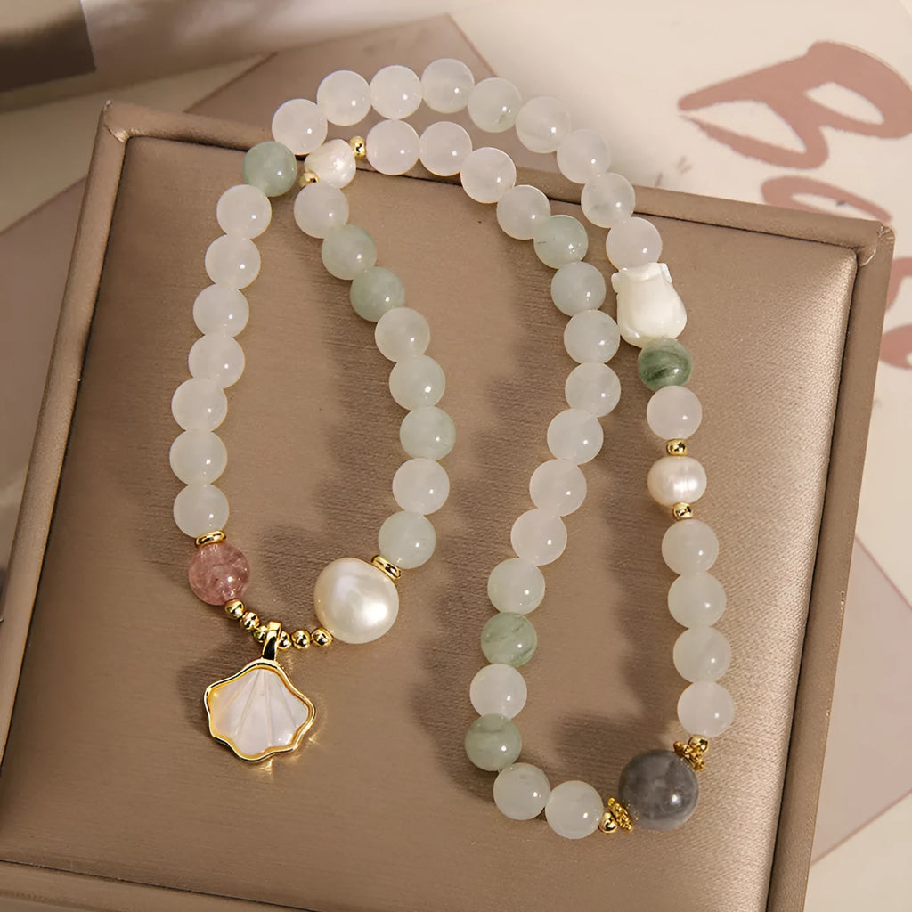 Women's crystal bracelet with Tianshan jade ginkgo leaf pendant and gold-plated gemstone settings
