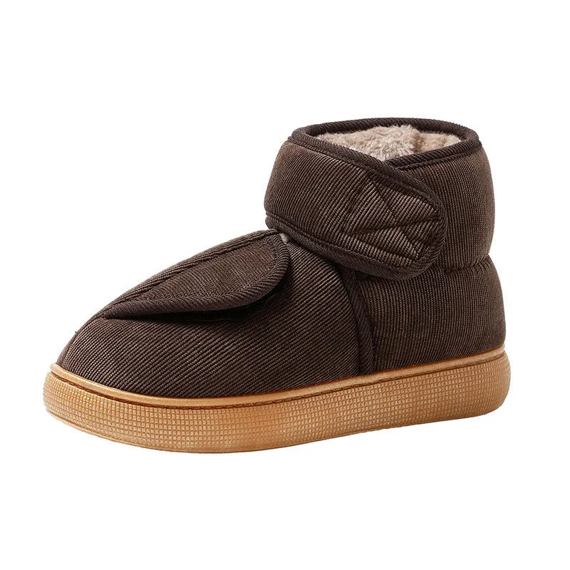 Large opening warm boots with anti-slip rubber soles, unisex slip-on design, plush upper and faux fur lining in black