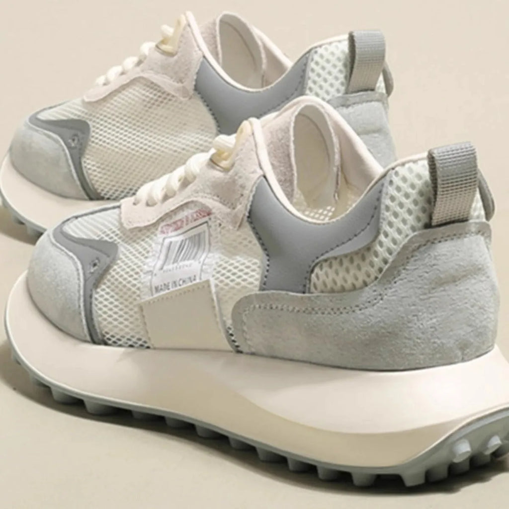 Women's grey and pink retro sneakers with low-top design and rubber sole