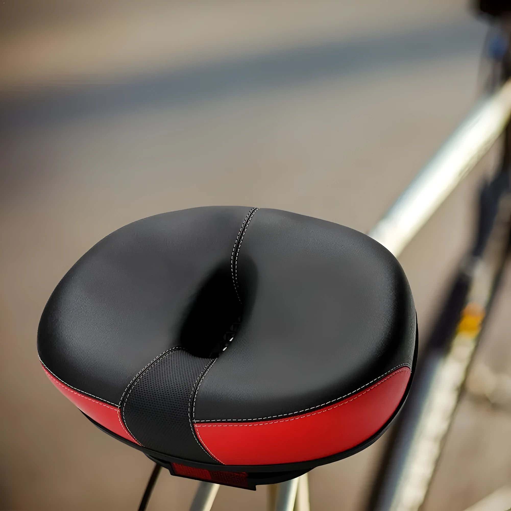 Thickened plus-size bicycle saddle in red with shock absorber and reflective stickers