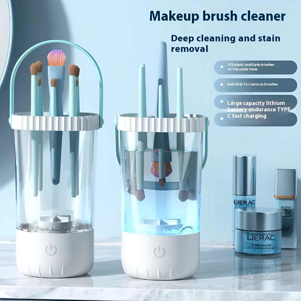 White rechargeable electric makeup brush cleaner with USB cable on a table.